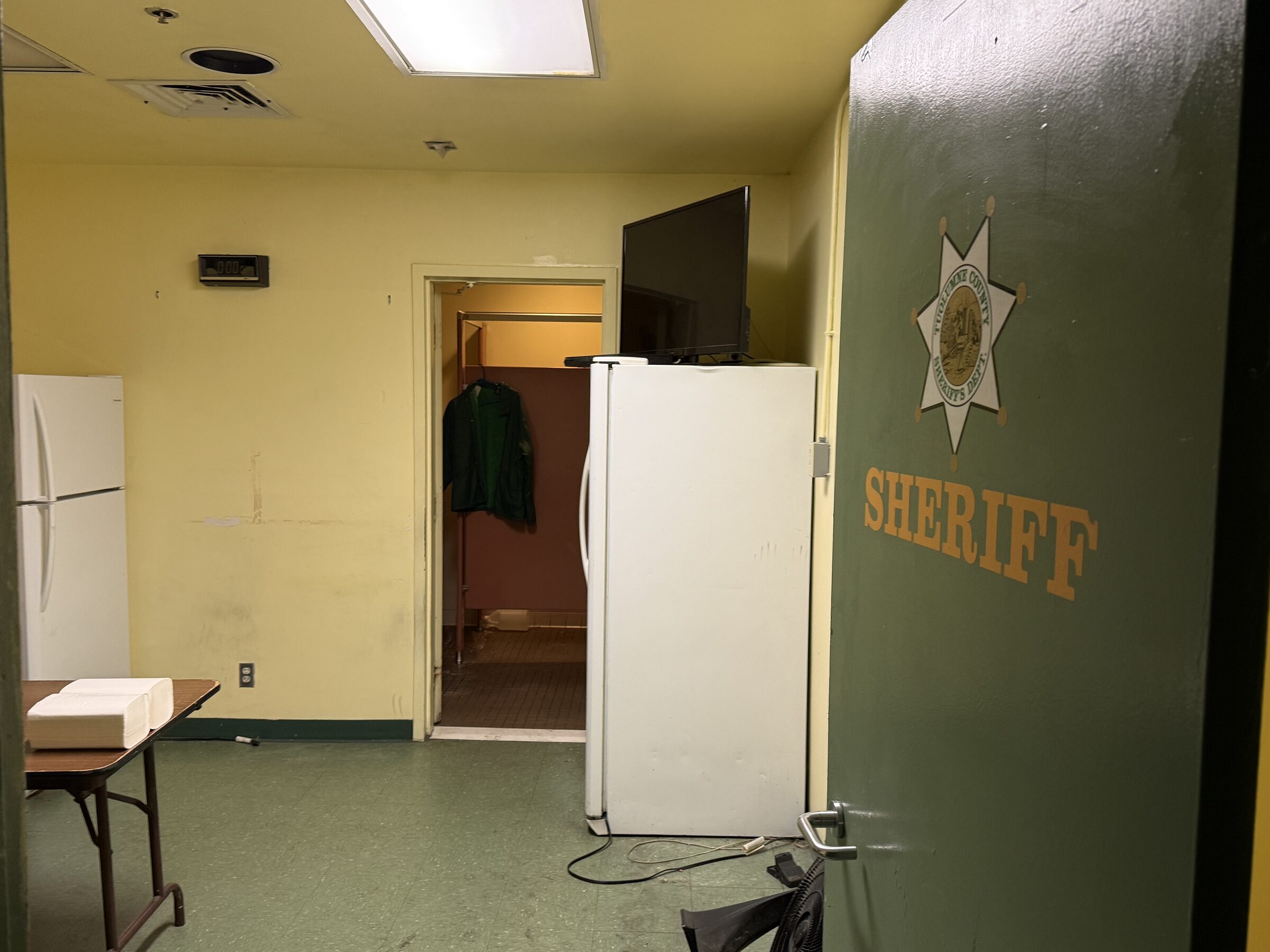 Open door with a sheriff star inside the vacant Tuolumne County Jail, Sonora